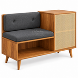 Mid-century modern wooden bench with a dark gray upholstered seat and backrest, featuring a cane panel side cabinet and open lower shelf, shown on a white background.